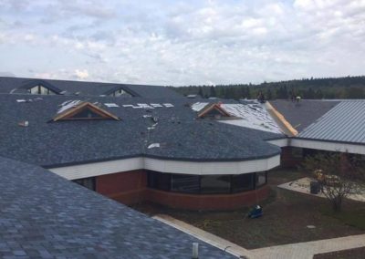 Another photo of a large commercial asphalt roof being installed