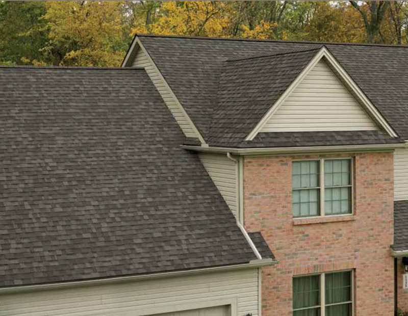Photo of the roof of a large Calgary surburban home with Owens Corning's Oakridge Shingles installed