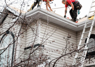 Photo of our roofers installing new starter stripping to a Calgary residential roof