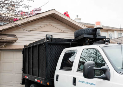 Photo of the dump truck we use to dispose of old, unwanted roofing materials and debris