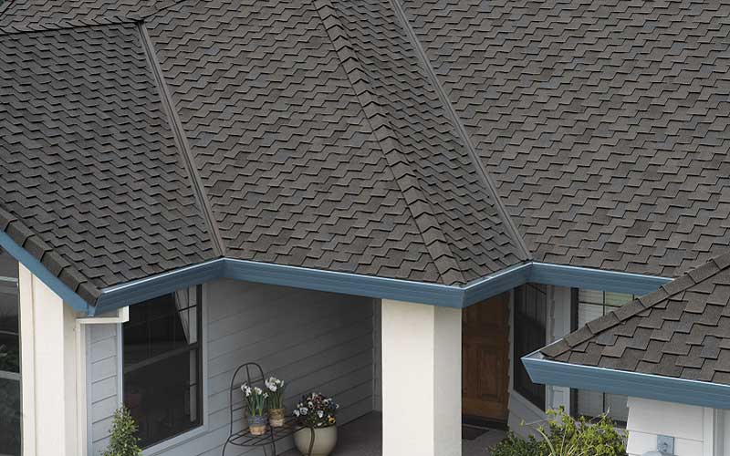 Photo of a large suburban Calgary home's roof with Owens Corning's Woodcrest Collection shingles