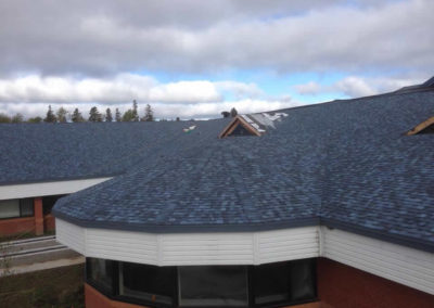 Photo of a large commercial roof undergoing repairs