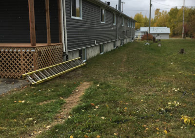 Photo of grey vinyl siding on a Calgary commercial building