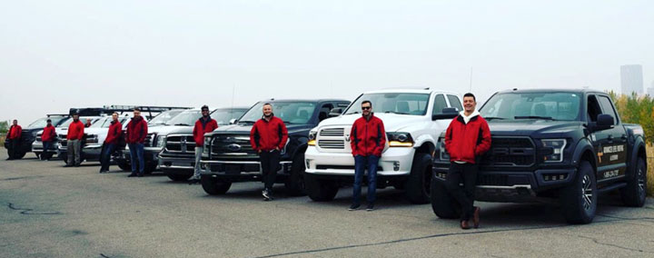 Photo of our local roofers and their roofing company trucks