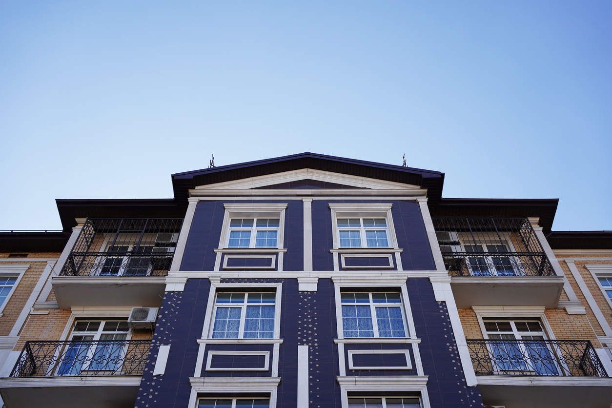 modern low-rise, multi-family house. affordable housing for a young family Call Advanced Level Roofing to learn more about multi-family roofing.